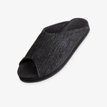Indosole Women's Pable Wabi slide in obsidian black — three-quarter view showing dark knit upper