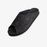 Indosole Women's Pable Wabi slide in obsidian black — three-quarter view showing dark knit upper