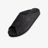 Indosole Women's Pable Wabi slide in obsidian black — three-quarter view showing dark knit upper