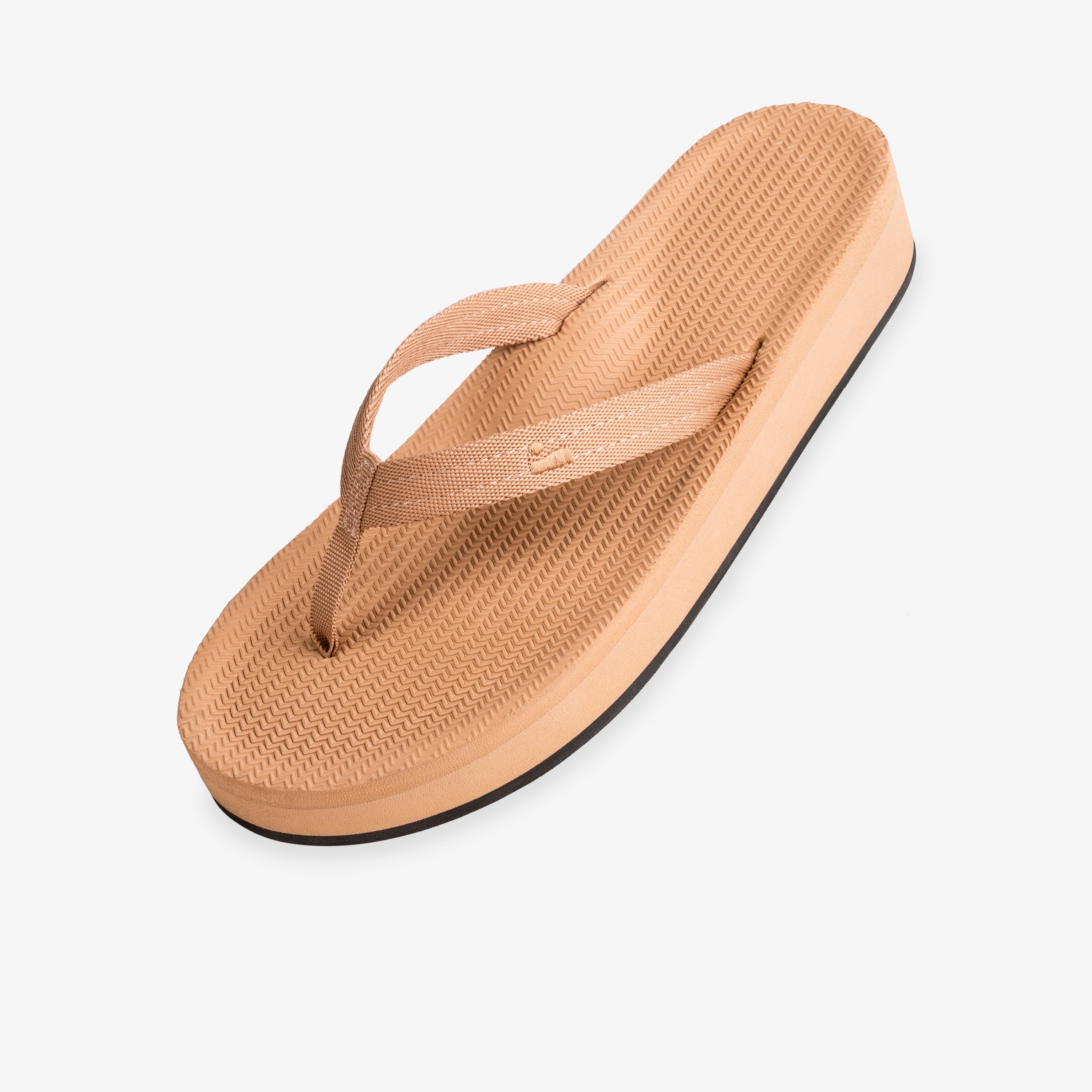Easy Living soil light platform flip flop — three-quarter view showing tan elevated sole