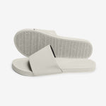 Stacked view of sea salt slides showing herringbone sole pattern and cream upper